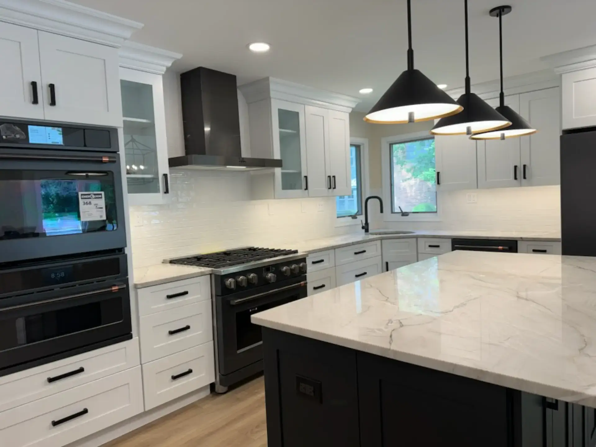 Black and white kitchen with a double wall oven