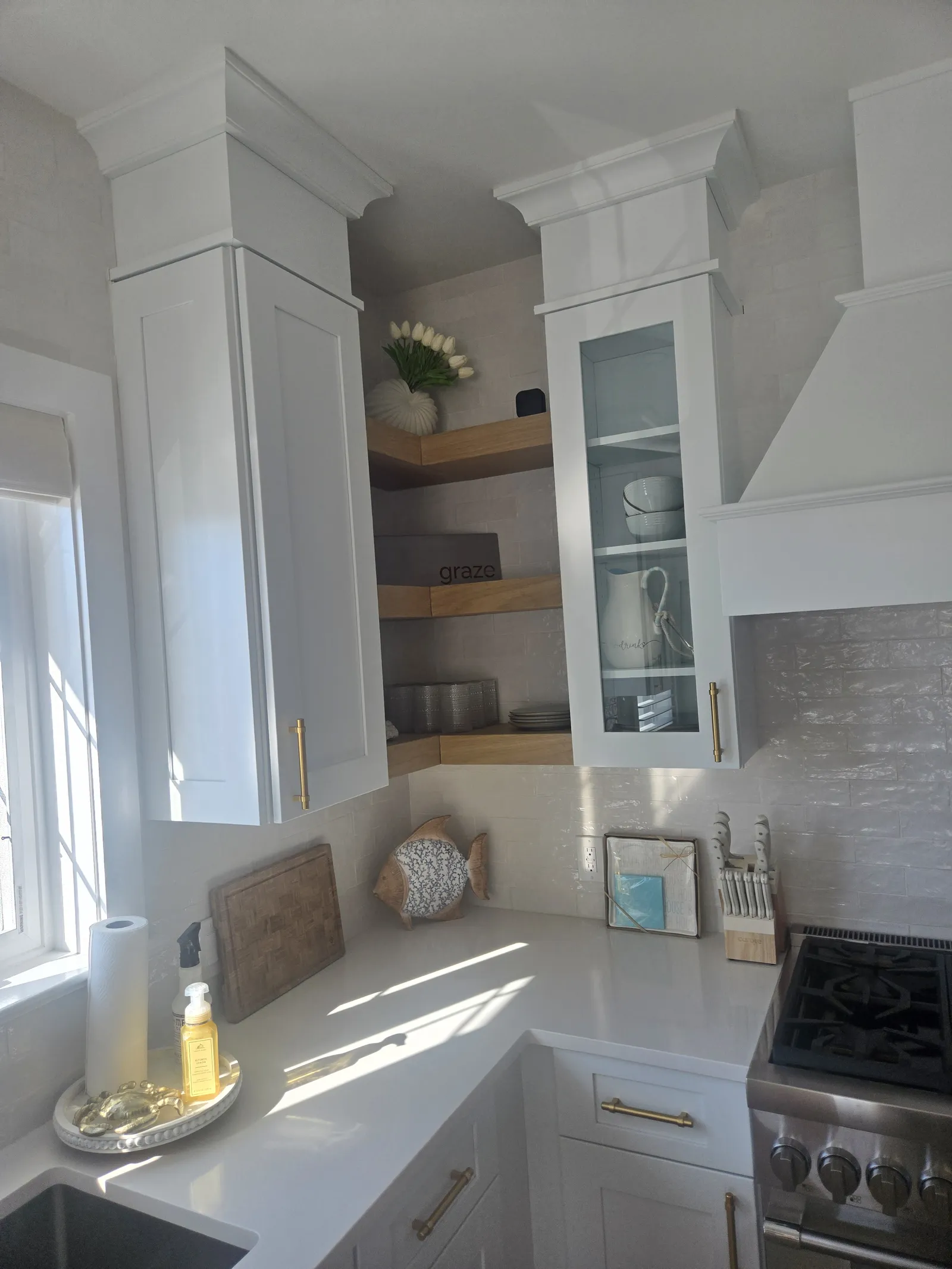 Range corner of the same white kitchen
