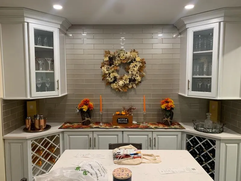 Glazed grey kitchen with built in wine storage