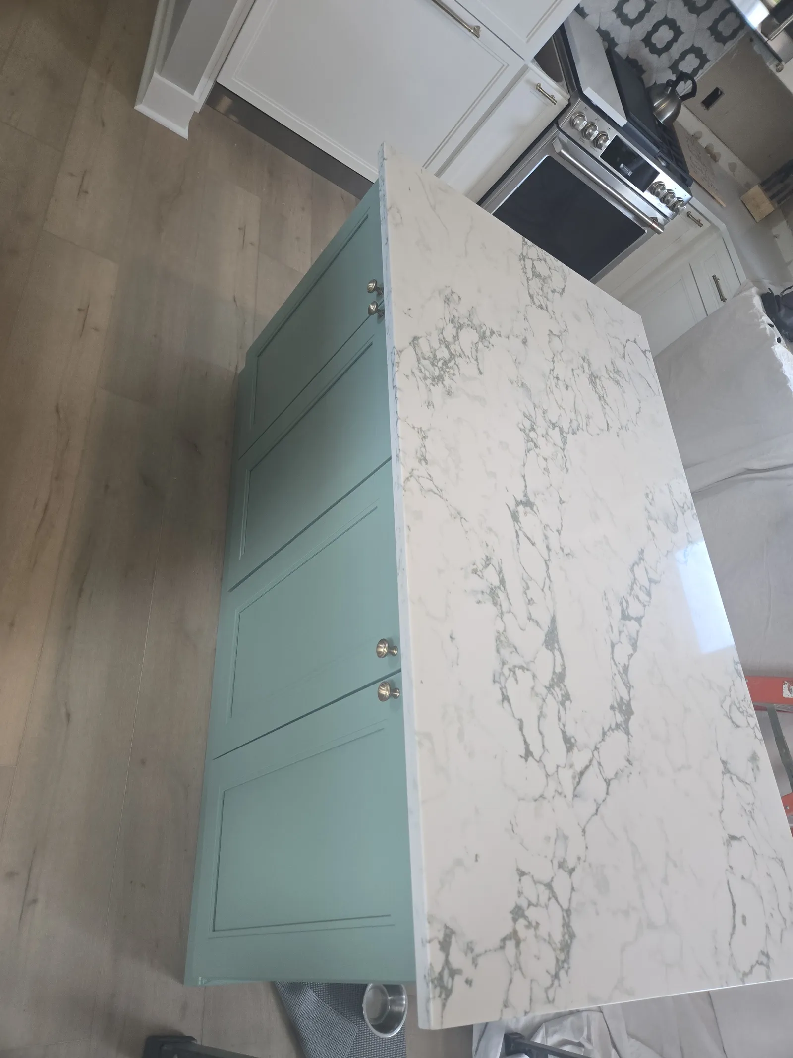 Teal island cabinetry, closer angle