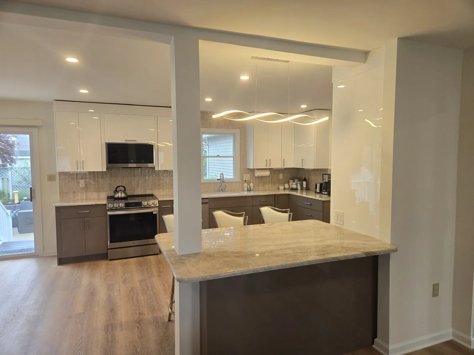 Two tone kitchen with white uppers and taupe lower cabinets