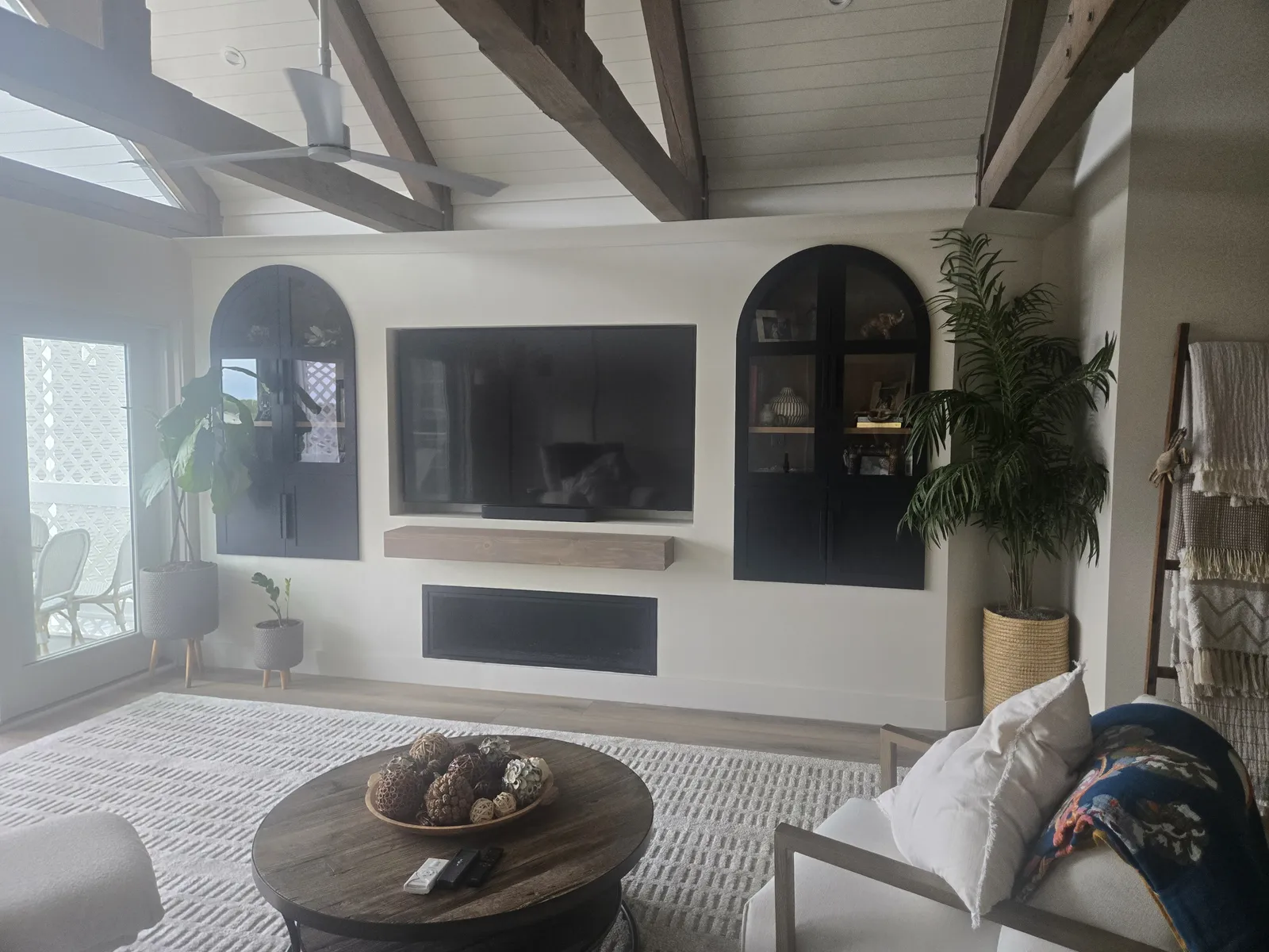 Arched black built in cabinets in the same home